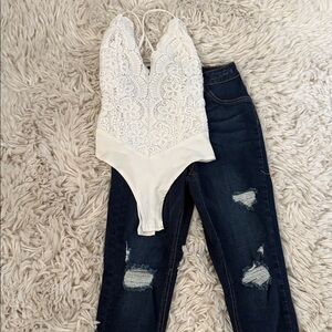 Ivory Lace Plunge Bodysuit and ripped skinny jeans